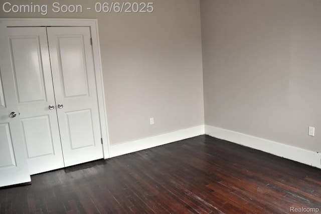 2054 Edison St, Detroit, MI 48206 - unfurnished bedroom with baseboards, dark wood-style flooring, and a closet