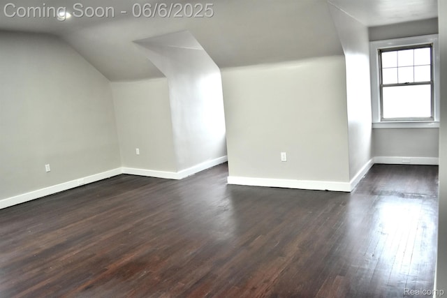 2054 Edison St, Detroit, MI 48206 - bonus room with baseboards, dark wood-style floors, and lofted ceiling