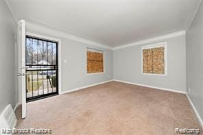 17167 Salem St, Detroit, MI 48219 - carpeted empty room featuring baseboards and crown molding