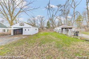 17167 Salem St, Detroit, MI 48219 - view of yard with a pole building, a detached garage, and an outdoor structure