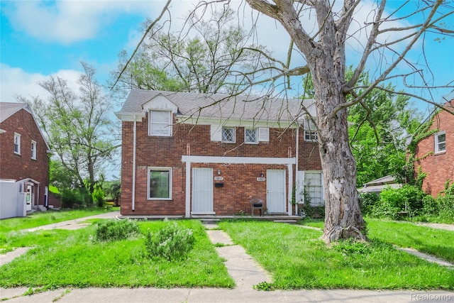 10817 Nottingham Rd, Detroit, MI 48224 - view of front facade featuring brick siding and a front yard