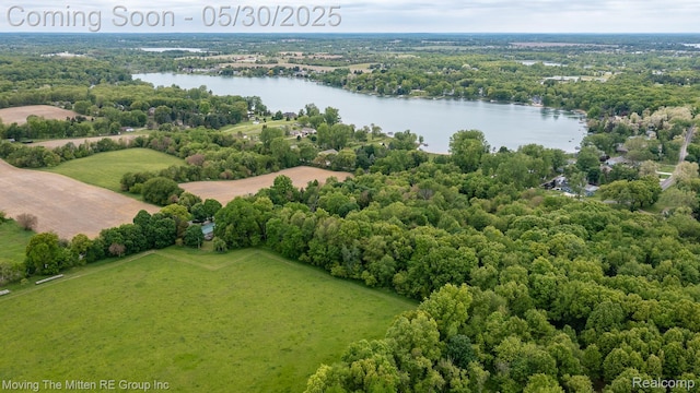 10531 Devils Lake Hwy, Addison, MI 49220 - drone / aerial view of a nearby body of water and a heavily wooded area