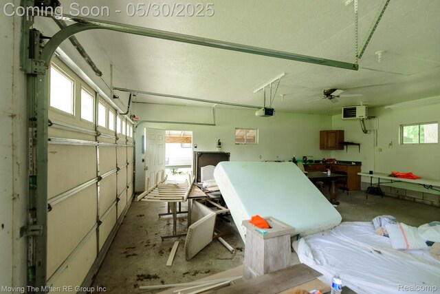10531 Devils Lake Hwy, Addison, MI 49220 - garage featuring a garage door opener and a heating unit