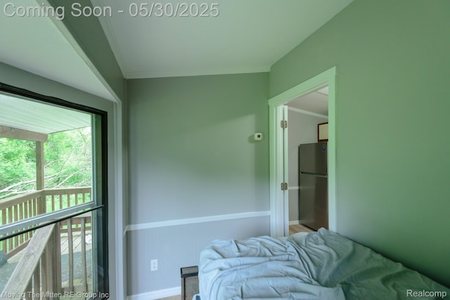 10531 Devils Lake Hwy, Addison, MI 49220 - bedroom with freestanding refrigerator, baseboards, and crown molding