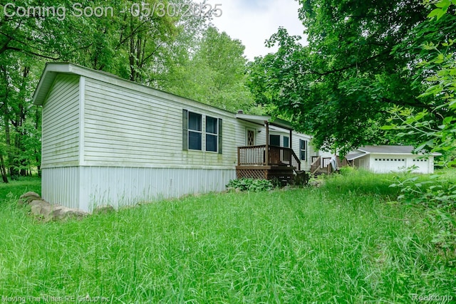 10531 Devils Lake Hwy, Addison, MI 49220 - rear view of property with view of scattered trees