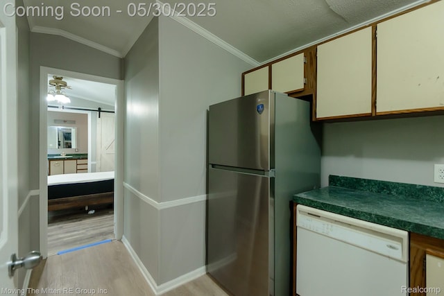 10531 Devils Lake Hwy, Addison, MI 49220 - kitchen with white dishwasher, freestanding refrigerator, light wood-type flooring, crown molding, and a barn door