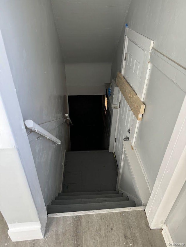 12632 E Canfield St, Detroit, MI 48215 - stairs featuring wood finished floors