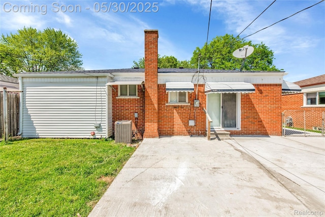7278 Superior, Center Line, MI 48015 - back of house with central AC, a chimney, a patio, and brick siding