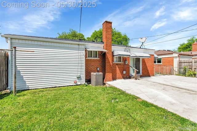 7278 Superior, Center Line, MI 48015 - back of property with central AC, a chimney, brick siding, and a patio