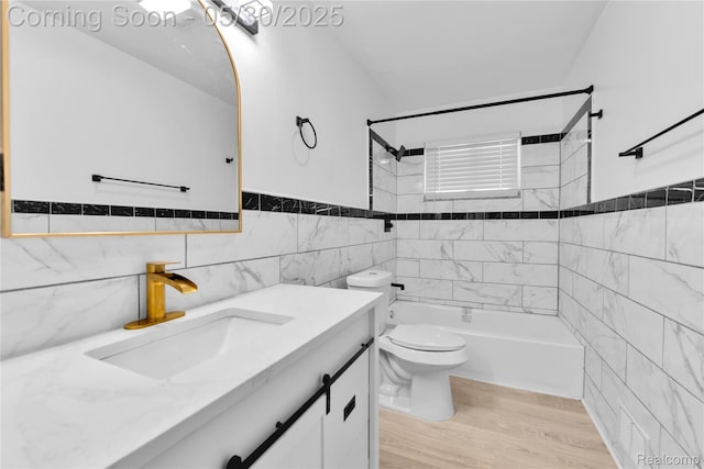 7278 Superior, Center Line, MI 48015 - full bathroom with tile walls, vanity,  shower combination, toilet, and wood finished floors