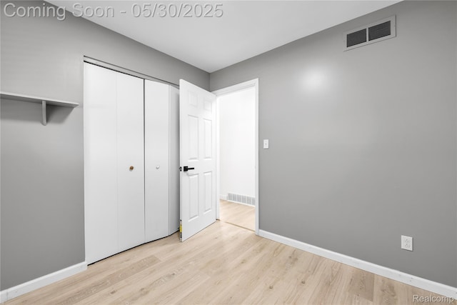 7278 Superior, Center Line, MI 48015 - unfurnished bedroom with wood finished floors, baseboards, and a closet