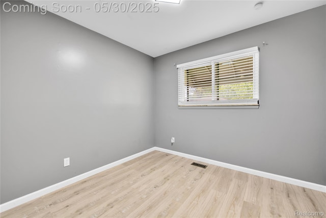 7278 Superior, Center Line, MI 48015 - spare room with wood finished floors, baseboards, and a smoke detector