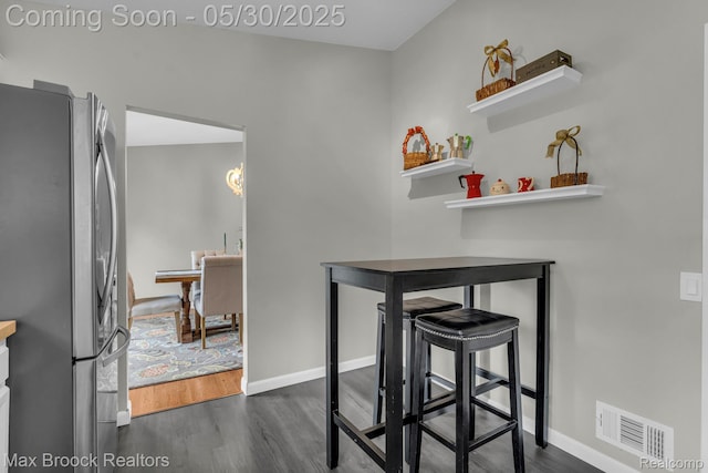 591 S Spinningwheel Ln, Bloomfield Hills, MI 48304 - dining space featuring dark wood-style floors and baseboards