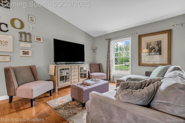 591 S Spinningwheel Ln, Bloomfield Hills, MI 48304 - living area featuring lofted ceiling and light wood finished floors