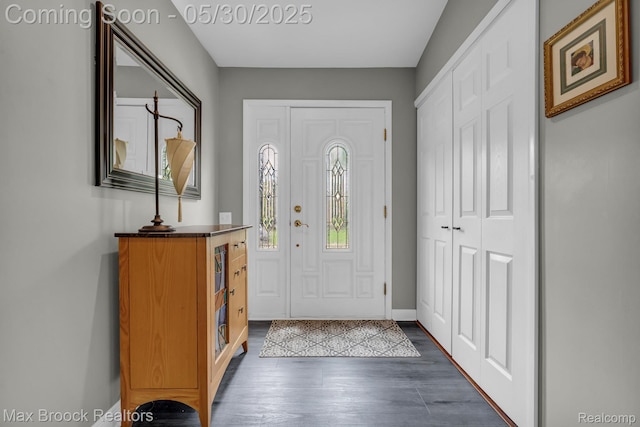 591 S Spinningwheel Ln, Bloomfield Hills, MI 48304 - entrance foyer featuring dark wood-type flooring and baseboards