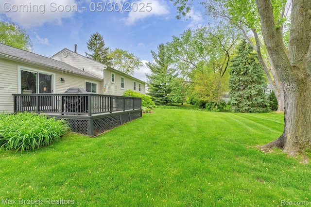 591 S Spinningwheel Ln, Bloomfield Hills, MI 48304 - view of grassy yard with a deck