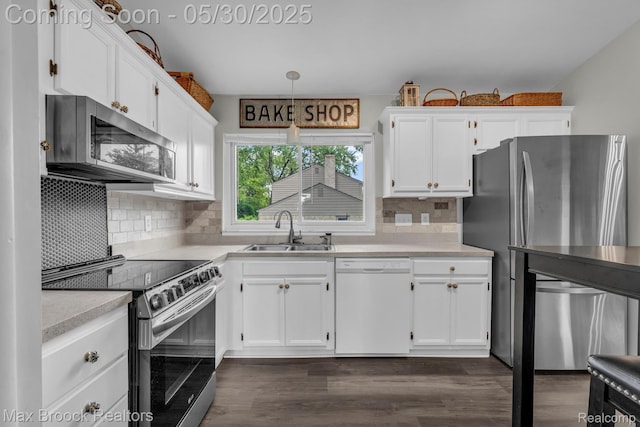 591 S Spinningwheel Ln, Bloomfield Hills, MI 48304 - kitchen featuring appliances with stainless steel finishes, a sink, white cabinetry, and light countertops
