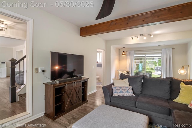 23355 Larkshire St, Farmington Hills, MI 48336 - living room with wood finished floors, beam ceiling, stairs, and baseboards