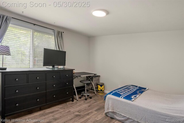 23355 Larkshire St, Farmington Hills, MI 48336 - bedroom with wood finished floors, baseboards, and a desk