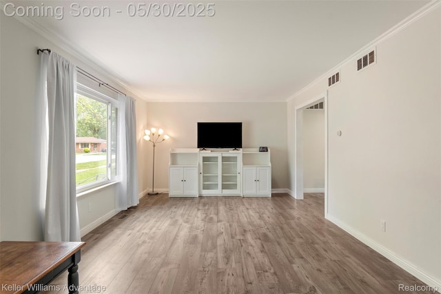 23355 Larkshire St, Farmington Hills, MI 48336 - unfurnished living room with wood finished floors, baseboards, and crown molding