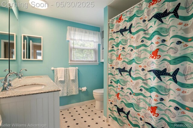 23355 Larkshire St, Farmington Hills, MI 48336 - full bathroom featuring double vanity, toilet, and baseboards