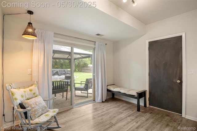 23355 Larkshire St, Farmington Hills, MI 48336 - sitting room with light wood-style floors and baseboards