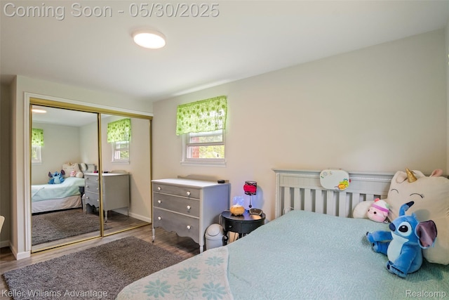 23355 Larkshire St, Farmington Hills, MI 48336 - bedroom featuring wood finished floors, a closet, and baseboards