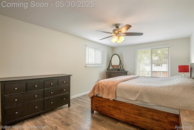 23355 Larkshire St, Farmington Hills, MI 48336 - bedroom with wood finished floors, baseboards, and ceiling fan