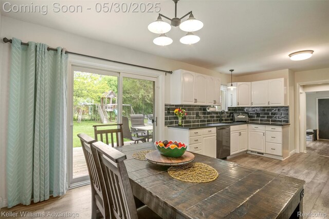 23355 Larkshire St, Farmington Hills, MI 48336 - dining area featuring light wood-style flooring and a chandelier