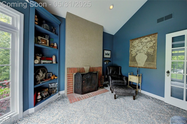 7730 Parkcrest Cir, Clarkston, MI 48348 - living area with high vaulted ceiling, baseboards, a fireplace, and carpet floors