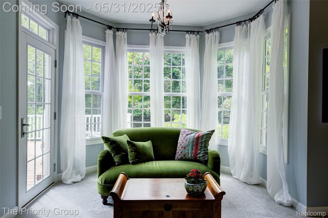 7730 Parkcrest Cir, Clarkston, MI 48348 - sunroom / solarium featuring plenty of natural light, french doors, and a chandelier