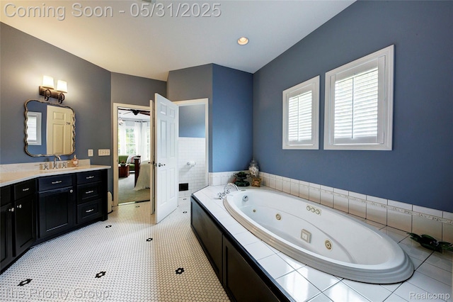 7730 Parkcrest Cir, Clarkston, MI 48348 - ensuite bathroom featuring a tub with jets, vanity, and tile patterned floors