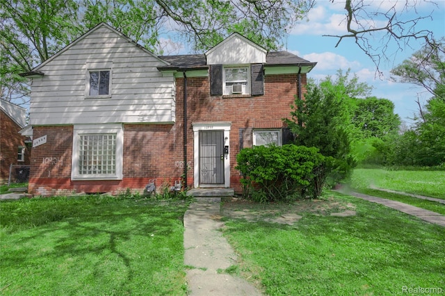 10898 Nottingham Rd, Detroit, MI 48224 - view of front facade featuring brick siding and a front lawn