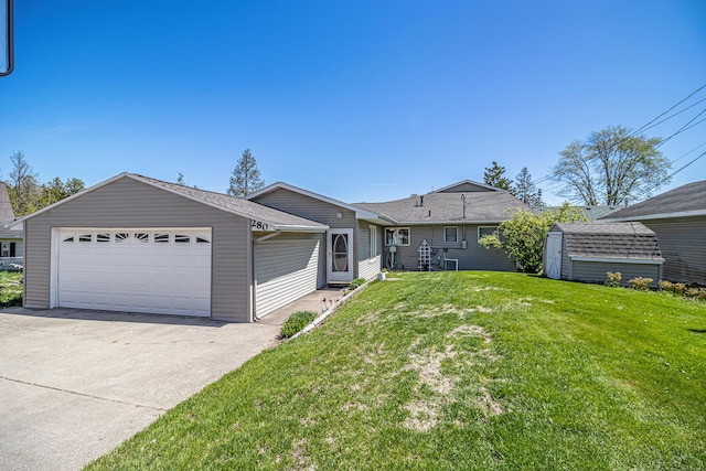 280 Rasmussen Dr, Trufant, MI 49347 - view of front of home with a front yard and a garage