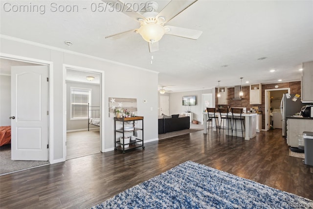 29 Fox Hound Ct, Grand Blanc, MI 48439 - living room with a ceiling fan, dark wood-style floors, ornamental molding, baseboards, and recessed lighting