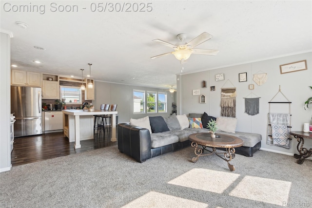 29 Fox Hound Ct, Grand Blanc, MI 48439 - living room with dark carpet, crown molding, ceiling fan, and baseboards