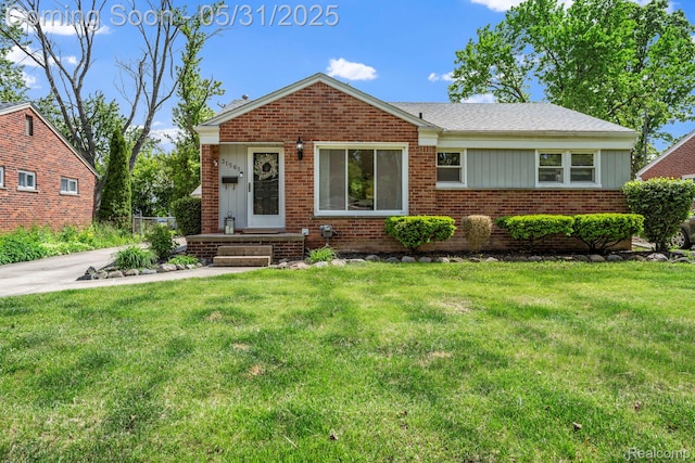 31561 Lamar Dr, Farmington, MI 48336 - view of front of home with brick siding and a front yard
