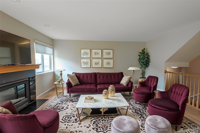 24511 Pinehurst Ave Unit 14, Oak Park, MI 48237 - living room with wood finished floors, a fireplace with flush hearth, and baseboards
