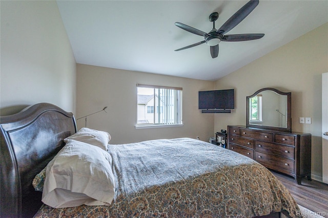 24511 Pinehurst Ave Unit 14, Oak Park, MI 48237 - bedroom with vaulted ceiling, wood finished floors, multiple windows, and a ceiling fan