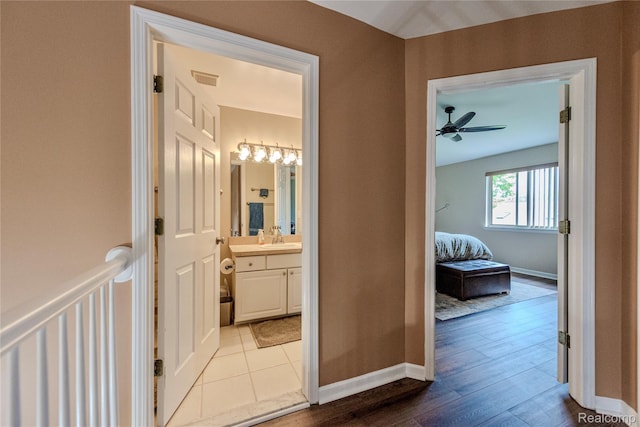 24511 Pinehurst Ave Unit 14, Oak Park, MI 48237 - hall featuring a sink, baseboards, and wood finished floors
