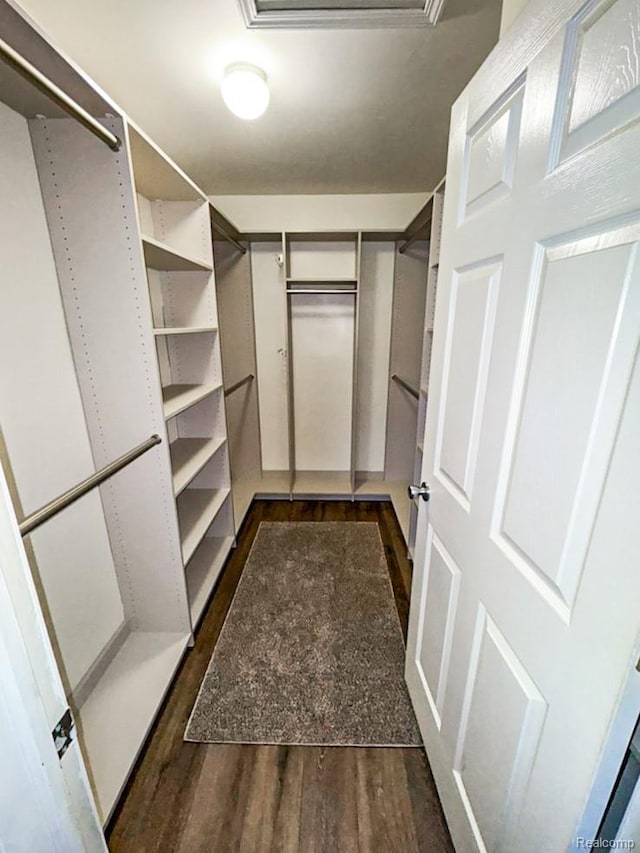 24511 Pinehurst Ave Unit 14, Oak Park, MI 48237 - spacious closet featuring dark wood-style floors