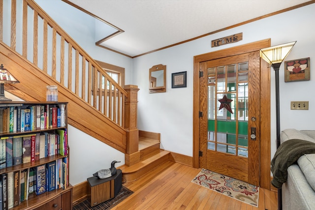 708 S Laurel St, Royal Oak, MI 48067 - foyer entrance with wood-type flooring, stairs, crown molding, and healthy amount of natural light