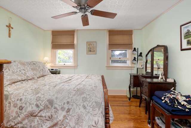 708 S Laurel St, Royal Oak, MI 48067 - bedroom featuring wood finished floors, crown molding, baseboards, and ceiling fan