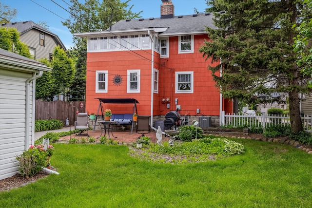 708 S Laurel St, Royal Oak, MI 48067 - back of property with a patio area, a chimney, and roof with shingles