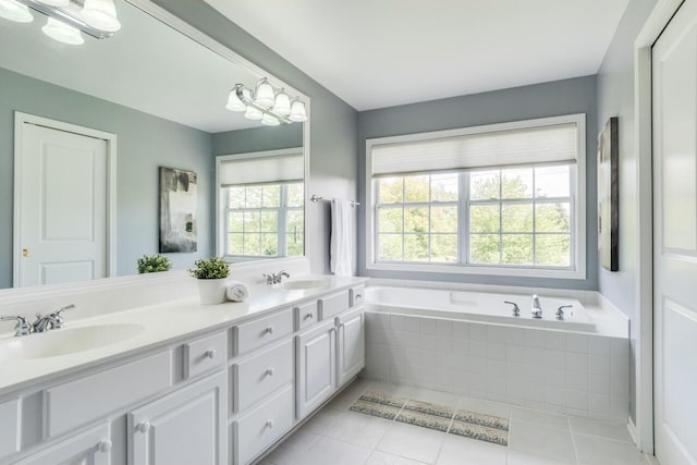 3352 Hampstead Ct, Portage, MI 49024 - full bath featuring double vanity, a garden tub, and tile patterned floors