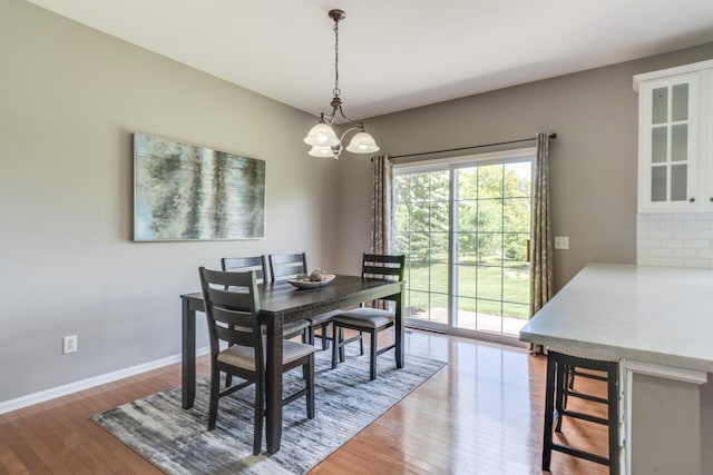 3352 Hampstead Ct, Portage, MI 49024 - dining room with wood finished floors, baseboards, and a chandelier