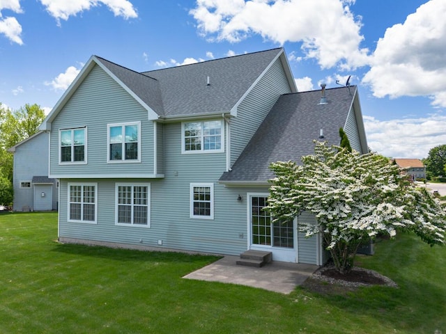 3352 Hampstead Ct, Portage, MI 49024 - back of property with a patio area, a shingled roof, and a yard