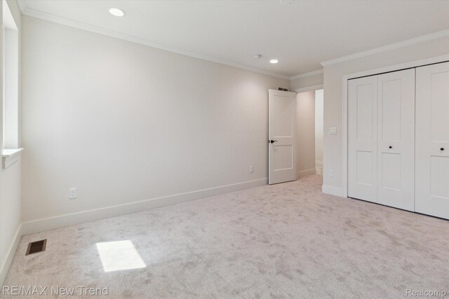 2911 Walsh Dr, Rochester Hills, MI 48309 - unfurnished bedroom with carpet flooring, recessed lighting, baseboards, crown molding, and a closet