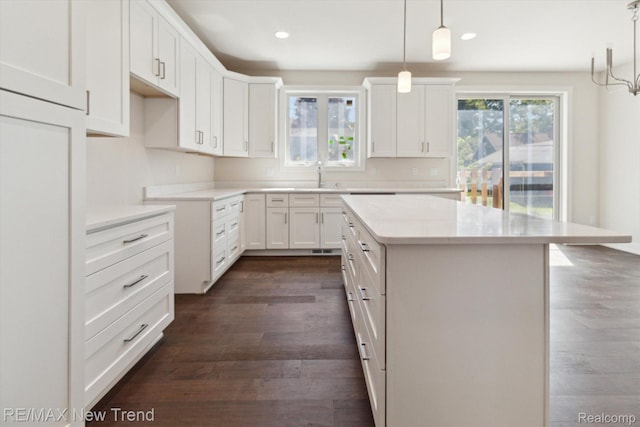 2911 Walsh Dr, Rochester Hills, MI 48309 - kitchen featuring dark wood-style floors, a center island, white cabinetry, and recessed lighting