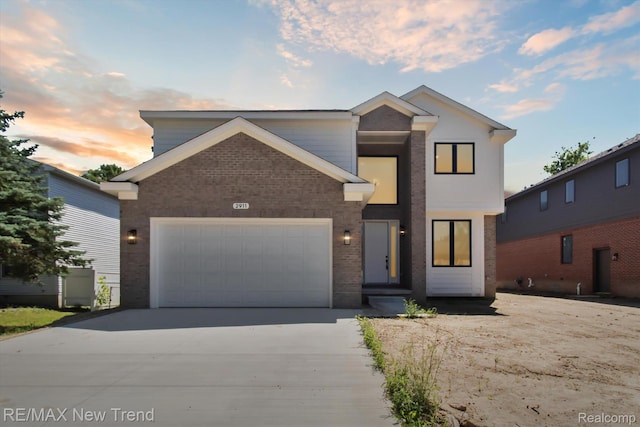 2911 Walsh Dr, Rochester Hills, MI 48309 - view of front of home with concrete driveway, brick siding, and a garage